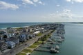 aerial shot of Banks Channel with vast blue ocean water and lush green plants and trees, homes and boats docked Royalty Free Stock Photo