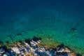 Aerial shot of beach with incredible turquoise colors and rocky cliffs greek island