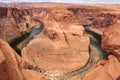 Aerial shot of the beautiful Horseshoe Bend in Arizona under the blue cloudy sky on a sunny day Royalty Free Stock Photo
