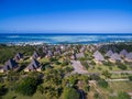 Aerial shot of the beautiful houses on the beach by the calm ocean captured in Zanzibar, Africa Royalty Free Stock Photo