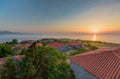 Aerial shot of the beautiful houses by the ocean under the sunset captured in Lesbos, Greece Royalty Free Stock Photo