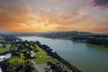 aerial shot of a beautiful spring landscape at Lake Merced with blue lake water and lush green trees, grass and plants at sunset Royalty Free Stock Photo