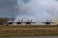 Aerial shot of Blue Angels causing white smoke after performing an air show