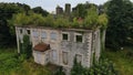 Aerial shot of Boomhall Historical landmark in Derry, Northern Ireland with wood trees