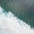 Aerial shot of the braking wave in the ocean. Royalty Free Stock Photo