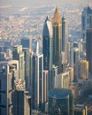 Aerial shot of bustling modern cityscape featuring multiple tall skyscrapers in Dubai, UAE.