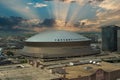 aerial shot of the Caesars Superdome and the Smoothie King Center with skyscrapers, office buildings and hotels