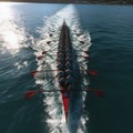 Aerial shot capturing rowers in the sea, displaying synchronized perfection