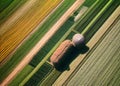 Aerial shot capturing the serene beauty of green fields during harvest. AI generated.