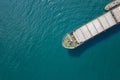 Aerial shot of a cargo ship approaching port Royalty Free Stock Photo