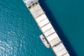 a cargo ship approaching port with help of towing ship Royalty Free Stock Photo