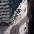 Aerial shot of a central city road between skyscrapers