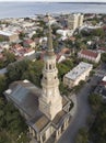 Aerial shot of the city of Charleston, South Carolina with the steeple of St Philips church in the foreground