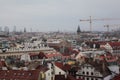 Aerial with shot of the city of Prague with buildings and cranes against a foggy sky Royalty Free Stock Photo