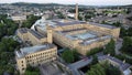 Aerial shot of cityscape Saltaire with Salts Mill building in daylight