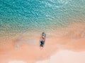 Aerial shot of Couple relaxing in a kayak Summer seascape beach and blue sea water Top view from drone