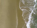 Aerial shot of the couple on the white sand beach in Thailand Royalty Free Stock Photo