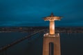 Aerial shot of Cristo Rei Christ Statue in Lisbon overlooking the city during nighttime Royalty Free Stock Photo