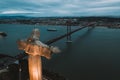 Aerial shot of Cristo Rei Christ Statue in Lisbon overlooking the city during nighttime Royalty Free Stock Photo