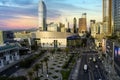 aerial shot of Crypto.com Arena and the Los Angeles Convention Center at sunset with cars driving on the street, skyscrapers