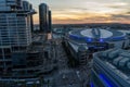 aerial shot of Crypto.com Arena and the Los Angeles Convention Center at sunset with cars driving on the street, skyscrapers