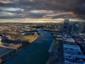 Aerial shot Cumberland River with bridges over the water surrounded by office building and bare winter trees with powerful clouds Royalty Free Stock Photo