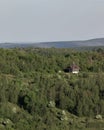 Aerial shot of a cute house in an amazing mountain landscape in Transylvania, Romania