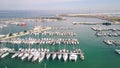 Aerial view of docked sailboats at marina