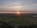 Aerial of sunset over agricultural meadowland and sea on the dutch island of Texel Royalty Free Stock Photo