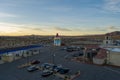 aerial shot of EddieWorld with cars and trucks driving on the highway, gas pumps and an ice cream shaped buildings at sunset Yermo