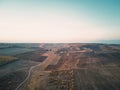 Aerial shot of empty autumn fields at sunset