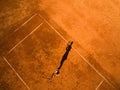 Aerial shot of a female tennis player on a court