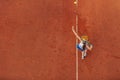 Aerial shot of a female tennis player on a court during match. Young woman playing tennis.High angle view. Royalty Free Stock Photo