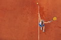 Aerial shot of a female tennis player on a court during match. Young woman playing tennis.High angle view. Royalty Free Stock Photo