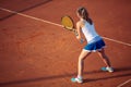 Aerial shot of a female tennis player on a court during match. Young woman playing tennis.High angle view. Royalty Free Stock Photo