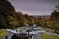 Aerial shot of the Five Rise Locks in Bingley and yellow trees captured on an autumn day Royalty Free Stock Photo