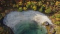 Aerial shot of a forest by a cliff in Hamaroy, Norway