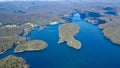 Aerial shot of forest islands scattered in turquoise waters and on the horizo Royalty Free Stock Photo