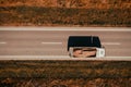 Aerial shot of freight truck transporting sand as construction material, top down drone pov