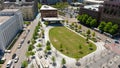 aerial shot of a gorgeous spring landscape at Miller Park with green trees and grass, people walking and office buildings