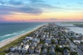 aerial shot of a a gorgeous summer landscape along the coastline with blue ocean water, homes, lush green trees and grass Royalty Free Stock Photo