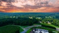 An aerial shot of a gorgeous summer landscape at the vineyard with miles of lush green trees grass and plants with powerful clouds Royalty Free Stock Photo