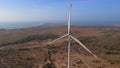 Aerial shot of a group of wind turbines in a semidesert environment. Green energy concept