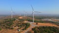 Aerial shot of a group of wind turbines in a semidesert environment. Green energy concept