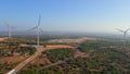 Aerial shot of a group of wind turbines in a semidesert environment. Green energy concept