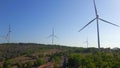 Aerial shot of a group of wind turbines in a semidesert environment. Green energy concept