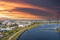 aerial shot of homes along the shores of Carolina Lake with hotels, retail stores and apartments in the city skyline Royalty Free Stock Photo