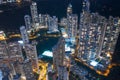 Aerial shot a Hong Kong cityscape with skyscapers at night time. Royalty Free Stock Photo