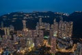 Aerial shot a Hong Kong cityscape with skyscapers at night time. Royalty Free Stock Photo