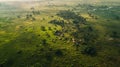 Aerial shot of an indigenous settlement in a vast landscape, showcasing ancestral land connection. Indigenous Peoples